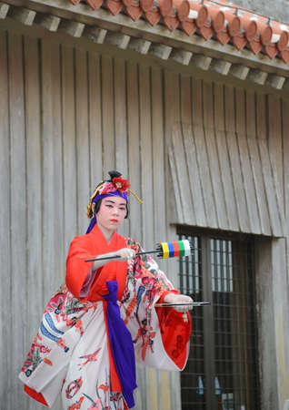 OKINAWA, JAPAN - OCTOBER 26 : Folk dance performing in Okinawa Palace taken October 26, 2013 in Okinawa.のeditorial素材