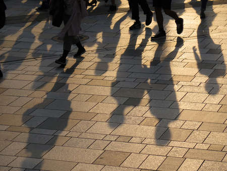 shadow of people walking together