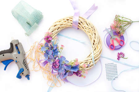 Handmade garland made of flowers and ribbonsの写真素材