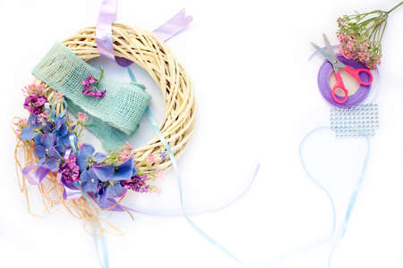 Handmade garland made of flowers and ribbonsの写真素材