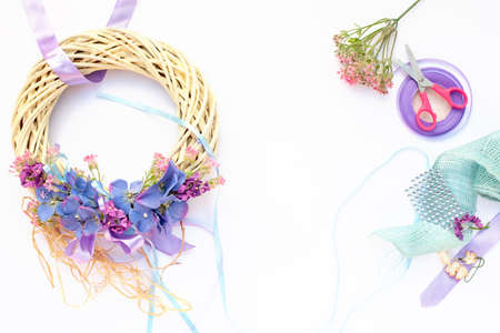 Handmade garland made of flowers and ribbonsの写真素材
