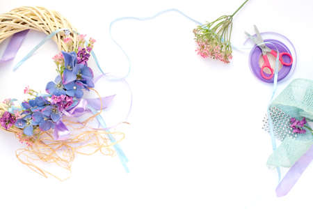 Handmade garland made of flowers and ribbonsの写真素材