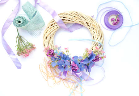 Handmade garland made of flowers and ribbonsの写真素材