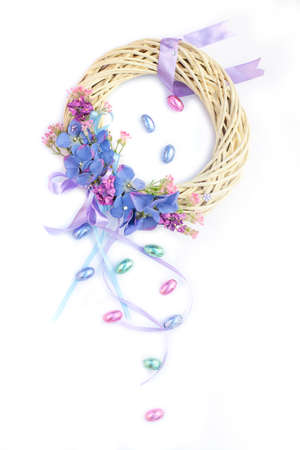 Beautiful pastel Easter Easter wreath with chocolate eggsの写真素材