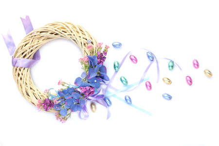 Beautiful pastel Easter Easter wreath with chocolate eggsの写真素材
