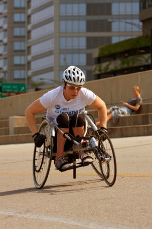 CHICAGO, IL - MAY 26:  An unidentified female in a racing wheelchair works out on an asphalt recreational area that runs alongside Chicago's famous Lakeshore Drive.  The warm weather brought many locals and tourists outside to enjoy the long Memorial Day のeditorial素材