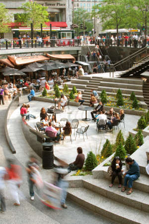 CHICAGO, IL - MAY 26:  Shoppers and tourists motion blur while moving through a plaza next to Water  Tower Place, a high-rise shopping mall on Chicago's Michigan Avenue.  The Memorial Day holiday weekend brought many tourists and locals into the downtown のeditorial素材