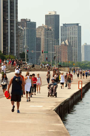 CHICAGO, IL - MAY 26:  Tourists and locals enjoy being outside along the Lake Michigan shoreline in Chicago, over the Memorial Day holiday weekend.  Hundreds of people came out to the asphalt recreational area that separates Lake Michigan from Lakeshore Dのeditorial素材