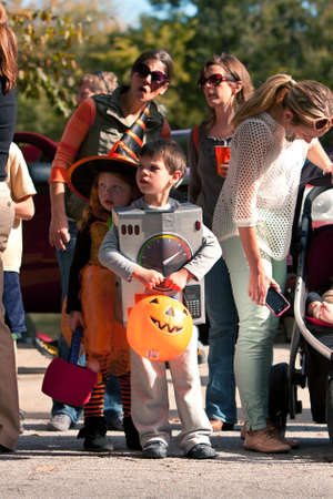 Atlanta, GA, USA - October 20, 2012:  Kids in Halloween costumes and their parents stare at an interesting sight just before the start of the Little Five Points Halloween parade, one of the largest Halloween parades in the southeast. のeditorial素材