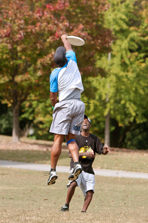 Atlanta, GA USA - October 27, 2012:  An unidentified young male jumps to catch a frisbee during an...