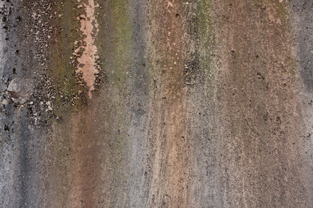 Grunge patterns cover concrete under bridge