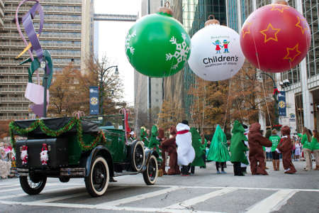 Atlanta, GA, USA - December 1, 2012:  People in costumes with floats gather at the start of the annual Atlanta Christmas parade in downtown Atlanta. のeditorial素材