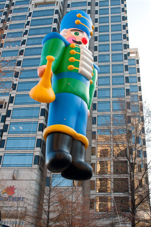 Atlanta, GA, USA - December 1, 2012:  A huge inflated toy soldier balloon moves through the parde...