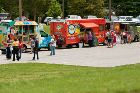 Atlanta, GA, USA - May 25, 2012:  Patrons buy food from food trucks at the GREAT festival, an event...