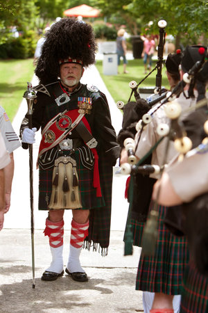 Atlanta, GA, USA - May 25, 2012: A drum major leads a local bagpipes group in performing at the...