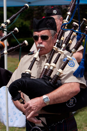 Atlanta, GA, USA - May 25, 2012: An unidentifed man plays the bagpipes to open the GREAT festival, a spring festival celebrating Great Britain and the United Kingdom, on the grounds of Oglethorpe University.のeditorial素材