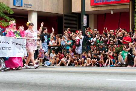 Atlanta, GA, USA - August 31, 2013:  Hundreds of spectators line Peachtree Street in downtown Atlanta, and take pictures as the annual Dragon Con parade passes by.のeditorial素材