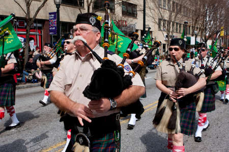 Atlanta, GA, USA - March 15, 2014   A bagpipes corps plays the bagpipes while marching in the St  Patrick s paradeのeditorial素材