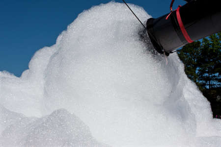 Bubble machine makes huge volume of foamy soap suds at event.の写真素材