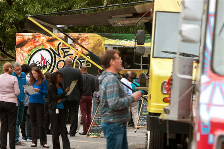 Atlanta, GA, USA - October 16, 2014:  Customers stand in line to order meals from popular food trucks during their lunch hour, at "Food Truck Thursday" in Atlanta.のeditorial素材