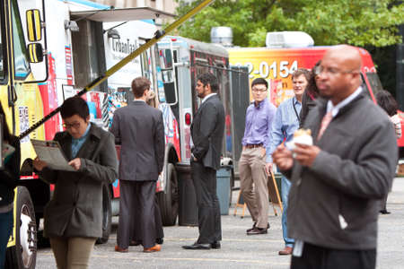Atlanta, GA, USA - October 16, 2014:  Customers stand in line to order meals from food trucks during their lunch hour, at "Food Truck Thursday" in Atlanta.のeditorial素材