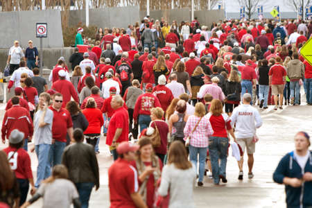 Atlanta, GA, USA - December 6, 2014:  Thousands of Alabama fans dressed in crimson walk toward the Georgie Dome to watch the SEC Championship game against Missouri.のeditorial素材