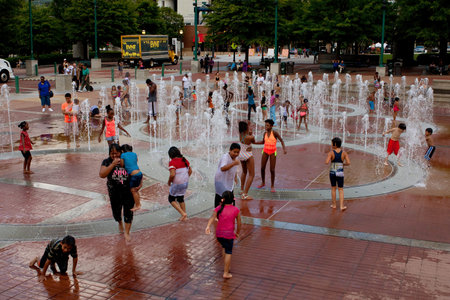 Atlanta, GA, USA - September 6, 2014: Families get soaking wet while playing in the fountain at Centennial Park in Atlanta.のeditorial素材