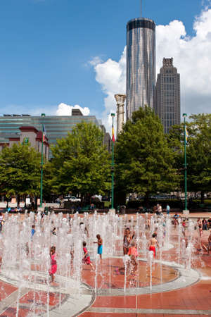 Atlanta, GA, USA - September 6, 2014: Kids get wet playing in the fountain at Centennial Park on a hot summer day in Atlanta.のeditorial素材