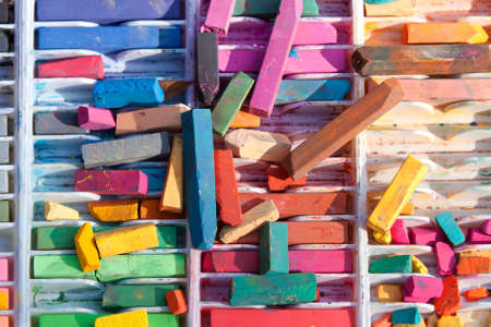 Several pieces of colorful chalk are used for street artの写真素材