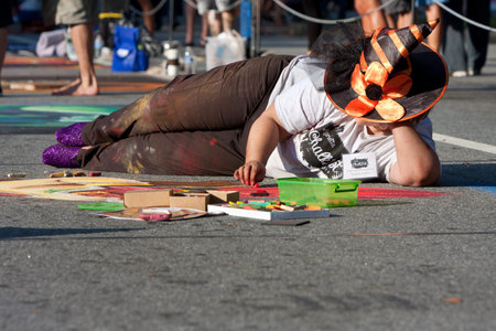 Marietta, GA, USA - October 11, 2014:  A chalk artist creates an elaborate Halloween scene on a downtown street as part of the Marietta Chalkfest.のeditorial素材
