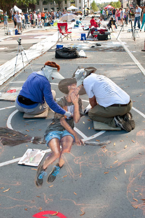 Marietta, GA, USA - October 11, 2014:  Chalk artists draw a Halloween scene on a downtown street as part of the Marietta Chalkfest.のeditorial素材