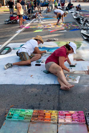 Marietta, GA, USA - October 11, 2014:  Chalk artists sketch out elaborate Halloween scenes on a downtown street as part of the Marietta Chalkfest.のeditorial素材
