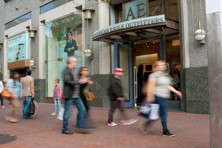 San Francisco, CA, USA - October 17, 2014:  Motion blur of shoppers walking by American Eagle...