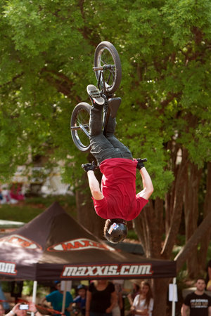 Athens, GA, USA - April 25, 2015:  Young BMX pro gets upside down performing trick in the pro BMX competition at the annual Athens Twilight Criterium, on April 25, 2015 in Athens, GA.のeditorial素材