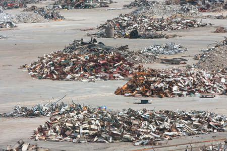 Piles of twisted metal, broken concrete and debris litter a demolition site.の写真素材