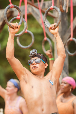 Conyers, GA, USA - August 22, 2015:  A young fit male with a GoPro camera strapped to his head,...