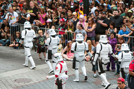 Atlanta, Ga, USA - September 3, 2016:  People dressed as storm troopers from the Star Wars movies interact with a huge crowd gathered to watch the annual Dragon Con parade on Peachtree Street on September 3, 2016 in Atlanta, GA.のeditorial素材