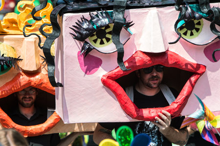 Atlanta, GA, USA - September 23, 2017:  Men wearing huge handmade custom masks walk in the East...