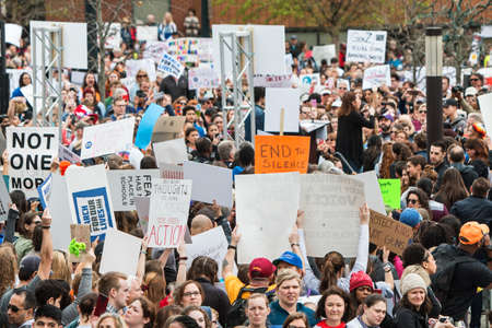 Atlanta, GA, USA - March 24, 2018: A huge crowd of people with anti-gun, anti-NRA signs gathers at a rally before the start of the March For Our Lives, on March 24, 2018 in Atlanta, GA.のeditorial素材
