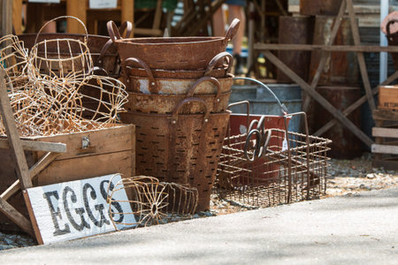 Vintage metal egg baskets sit on sale at Georgia antique festival.