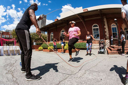 Atlanta, GA, USA - September 15, 2018:  A woman jumps rope double dutch style at the Pretty Girls Sweat Fest, on September 15, 2018 in Atlanta, GA.のeditorial素材