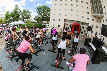 Atlanta, GA, USA - September 15, 2018:  Several women participate in an outdoor spin class at the Pretty Girls Sweat Fest on September 15, 2018 in Atlanta, GA.のeditorial素材