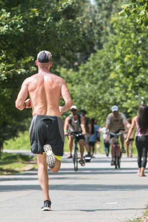 Atlanta, GA, USA - July 6, 2019:  People run, walk and ride bikes along the Atlanta Belt Line at the Old Fourth Ward Park, on July 6, 2019 in Atlanta, GA.のeditorial素材