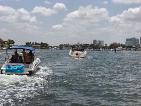 Ft. Lauderdale, Florida - May 26, 2019:  Boats crowd the intercoastal waterway as people celebrate the start of summer and the Memorial Day holiday on May 26, 2019 in Ft. Lauderdale, Florida.のeditorial素材