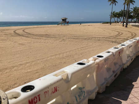 Fort Lauderdale, Florida / USA - May 21, 2020:  Barriers block access to a public beach in Fort Lauderdale, as the beaches remain empty and closed for the Covid-19 pandemic public health crisis, on May 21, 2020 in Fort Lauderdale, Florida.のeditorial素材