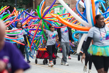 Atlanta, GA / USA - October 15, 2023:  PNC Bank employees wear colorful balloons while walking in the annual pride parade on October 15, 2023 in Atlanta, GA.のeditorial素材