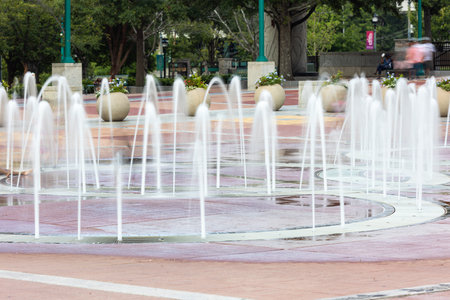 Spurts of water shooting up from the ground motion blur at Centennial Olympic Park in Atlanta.の写真素材