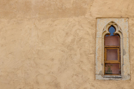 Still life shows lone window in medieval building in Germany.