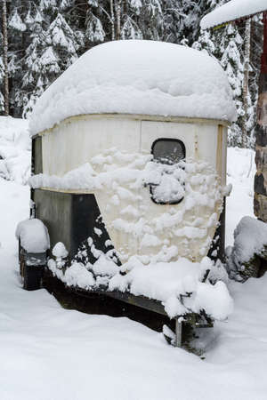 A horse trailer covered in snowの写真素材