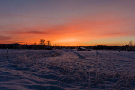 Sunset over a snowy and cold varmland, Swedenの写真素材